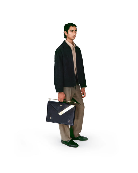 Model styling the Lifafa luxury envelope shoulder bag