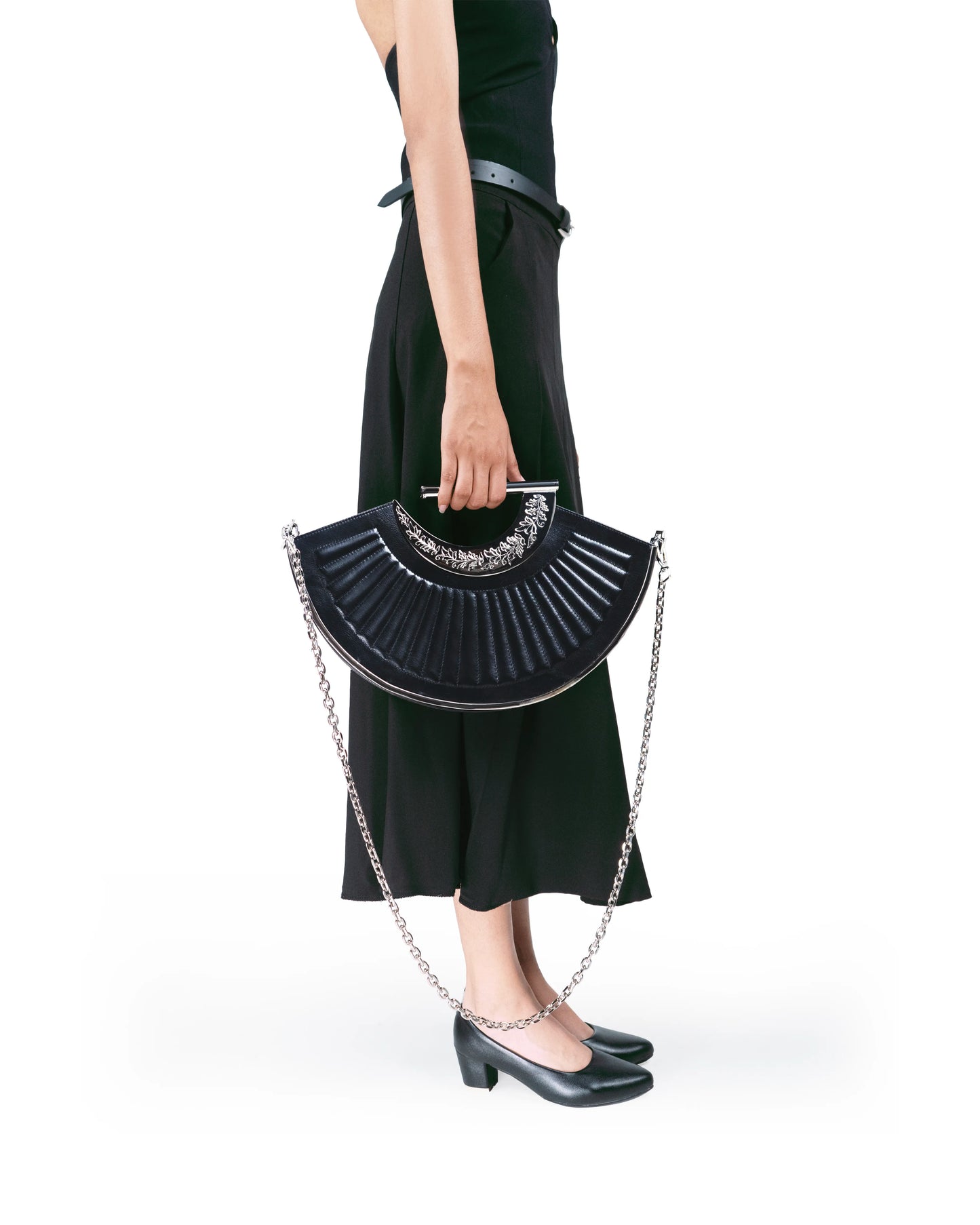 Quilted leather texture on premium sculptural bag