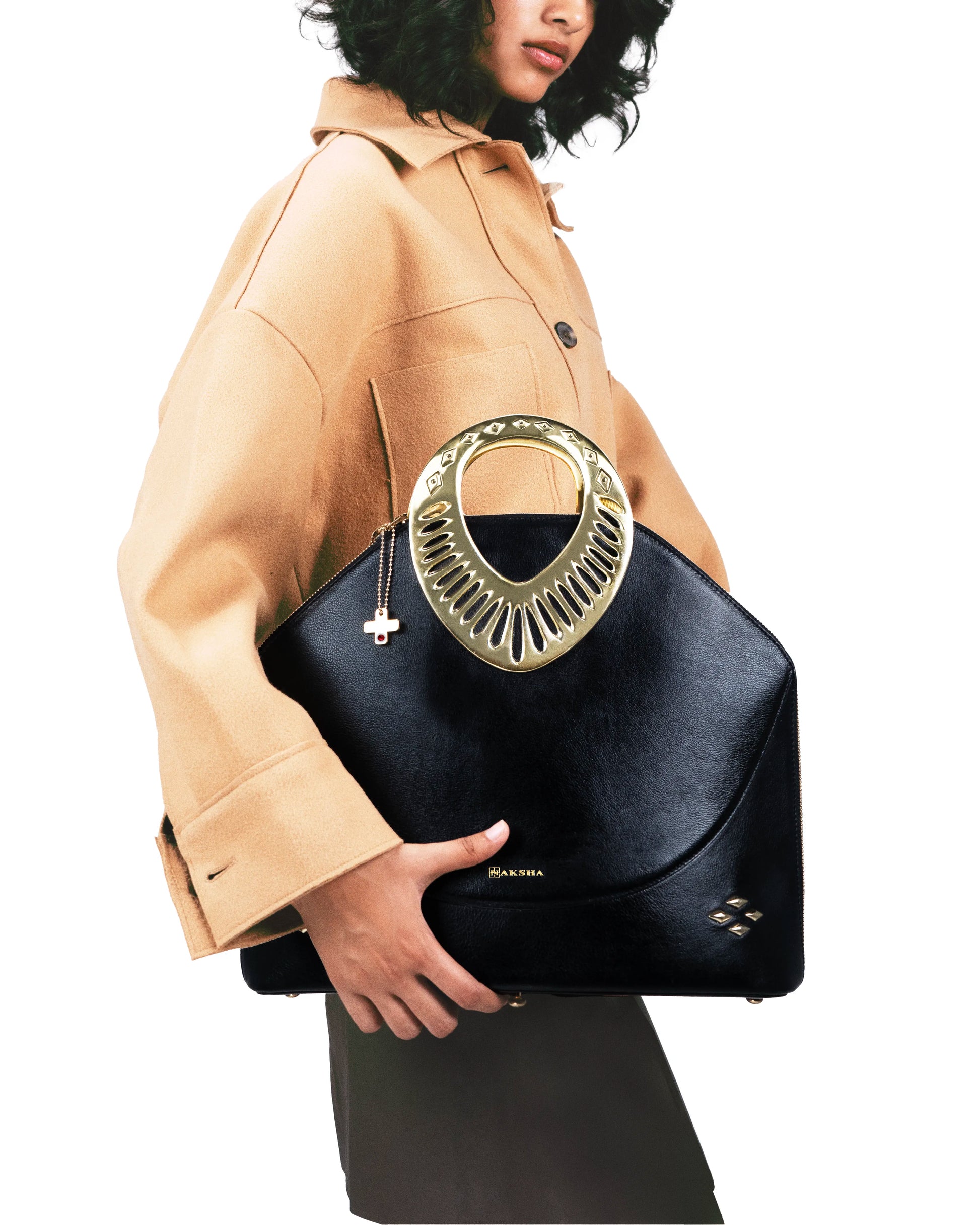Structured leather bag with sculptural dual handles and sacred geometry