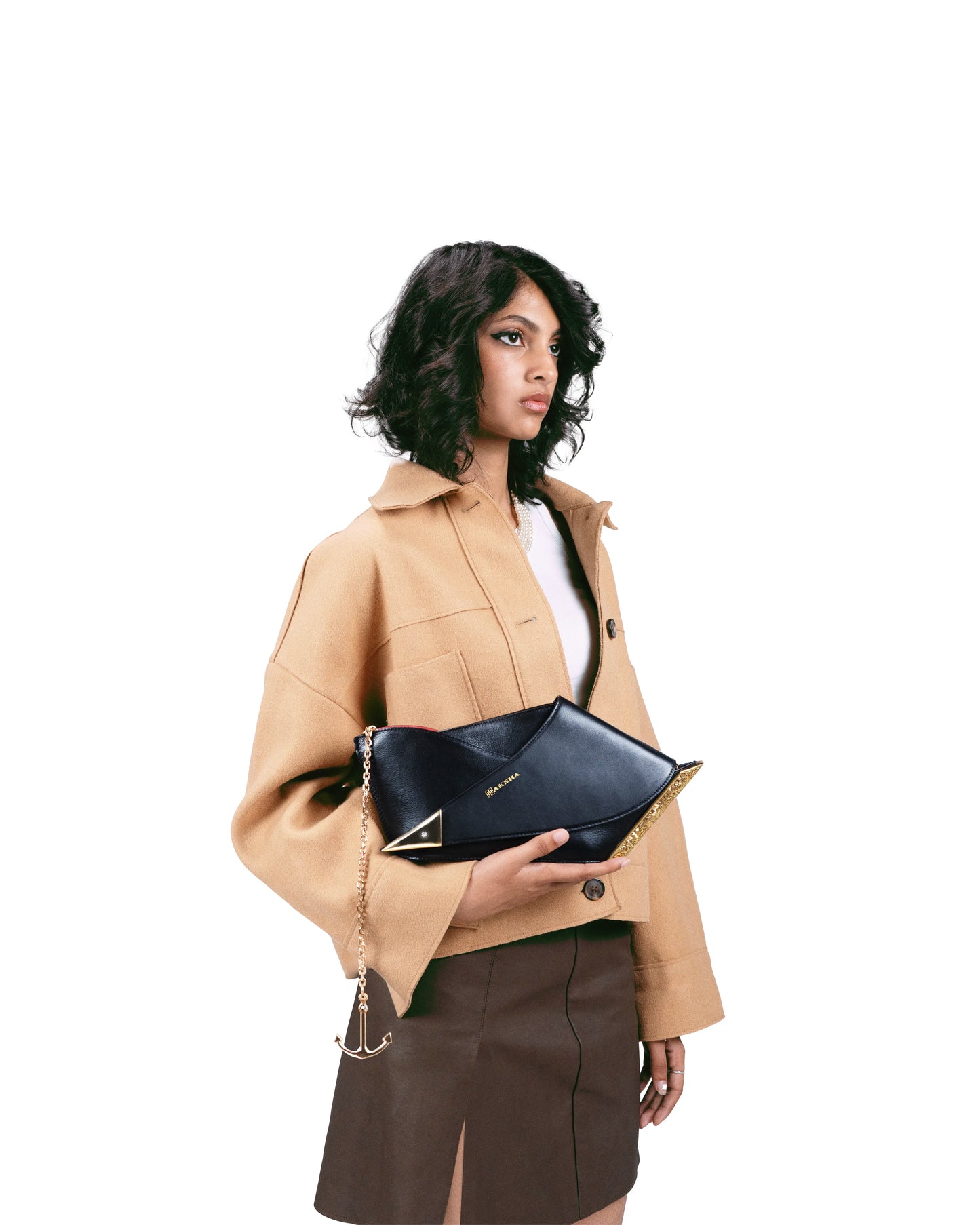 Naav sculptural luxury clutch styled with contemporary fashion – Naksha Outpost