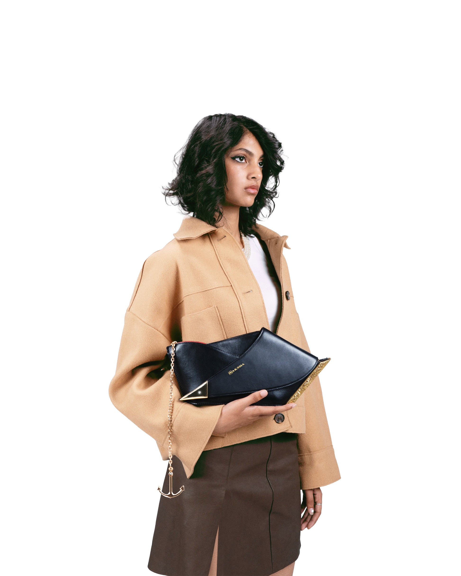 Naav sculptural luxury clutch styled with contemporary fashion – Naksha Outpost
