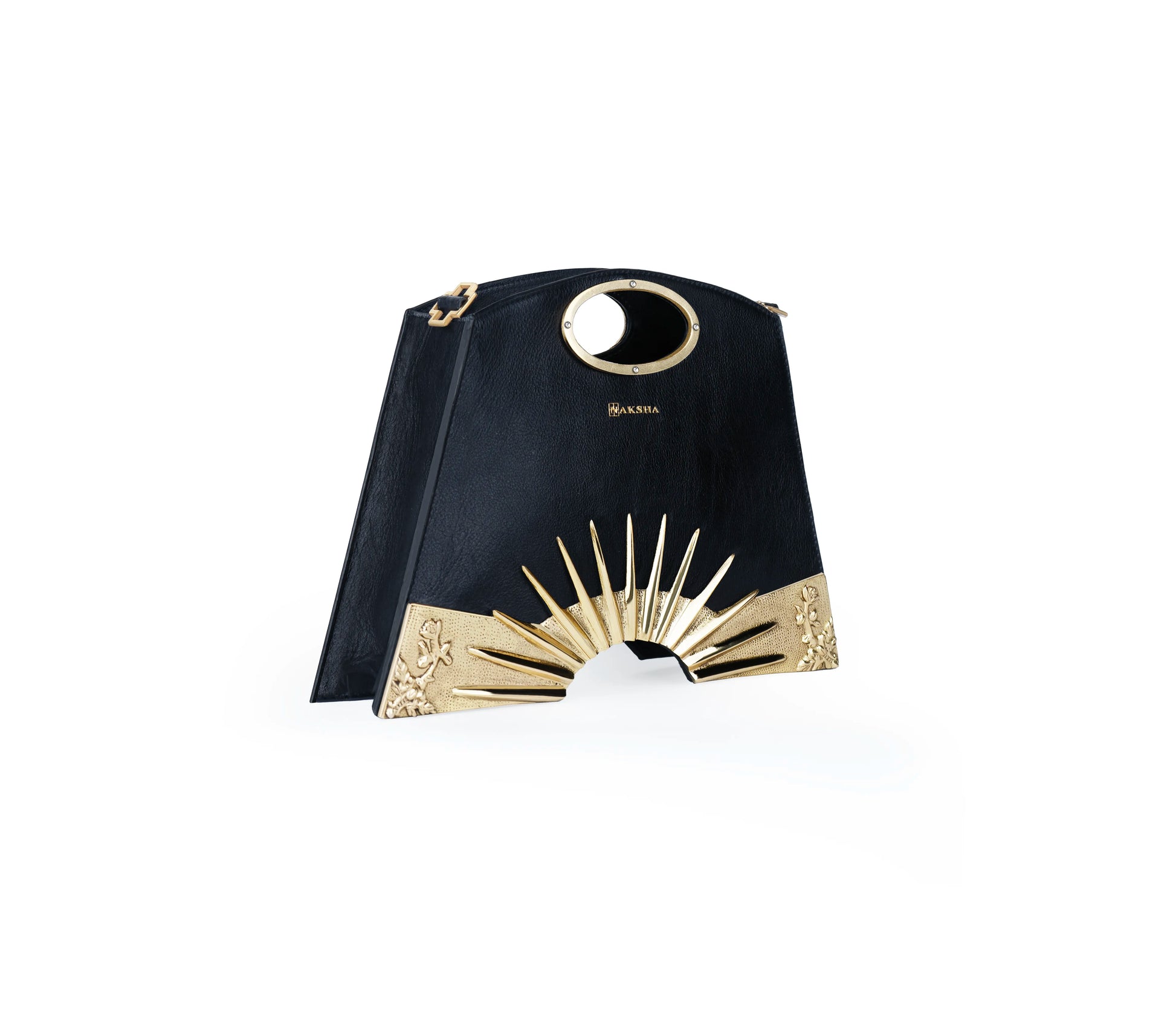 Jewelry-like engraved handle with sunburst detailing on designer handbag