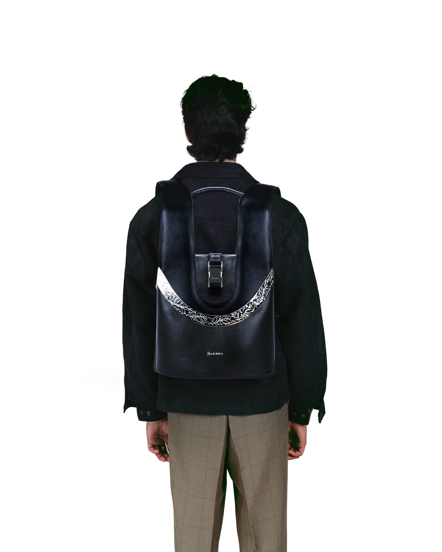 Structured full-grain leather mini backpack with elegant curved silhouette