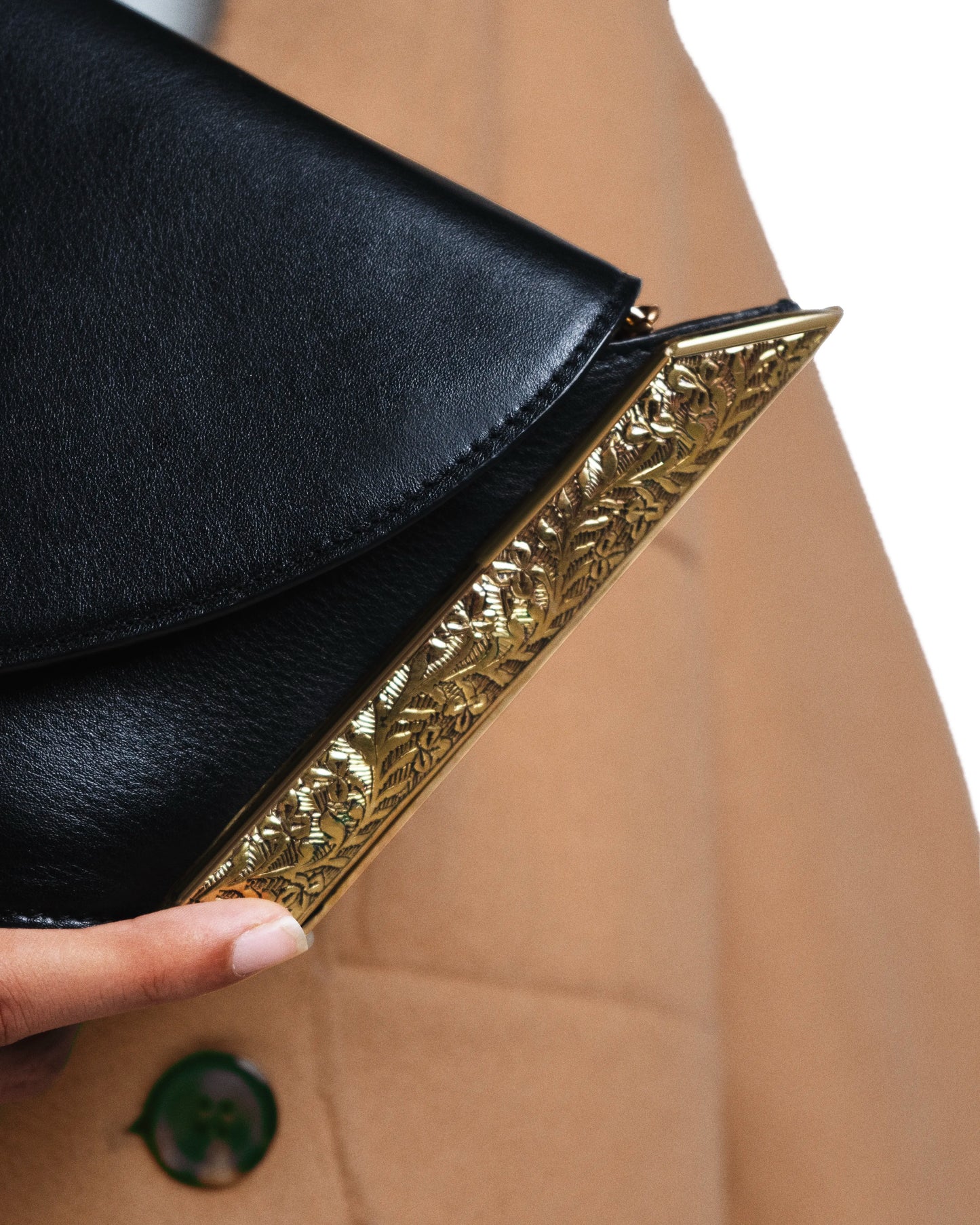 Hand-engraved 22k gold-plated floral motif hardware crafted by Indian artisans