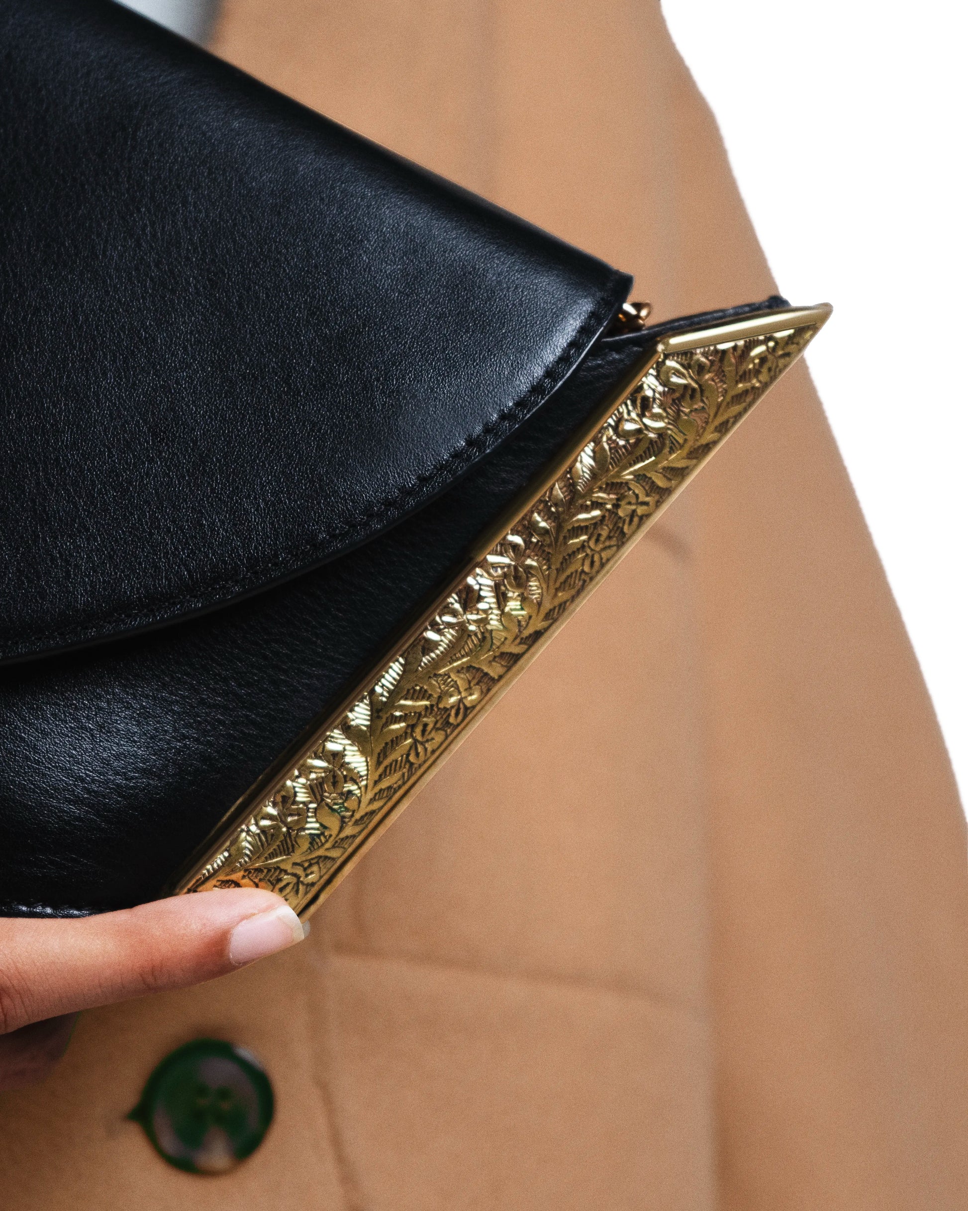 Hand-engraved 22k gold-plated floral motif hardware crafted by Indian artisans