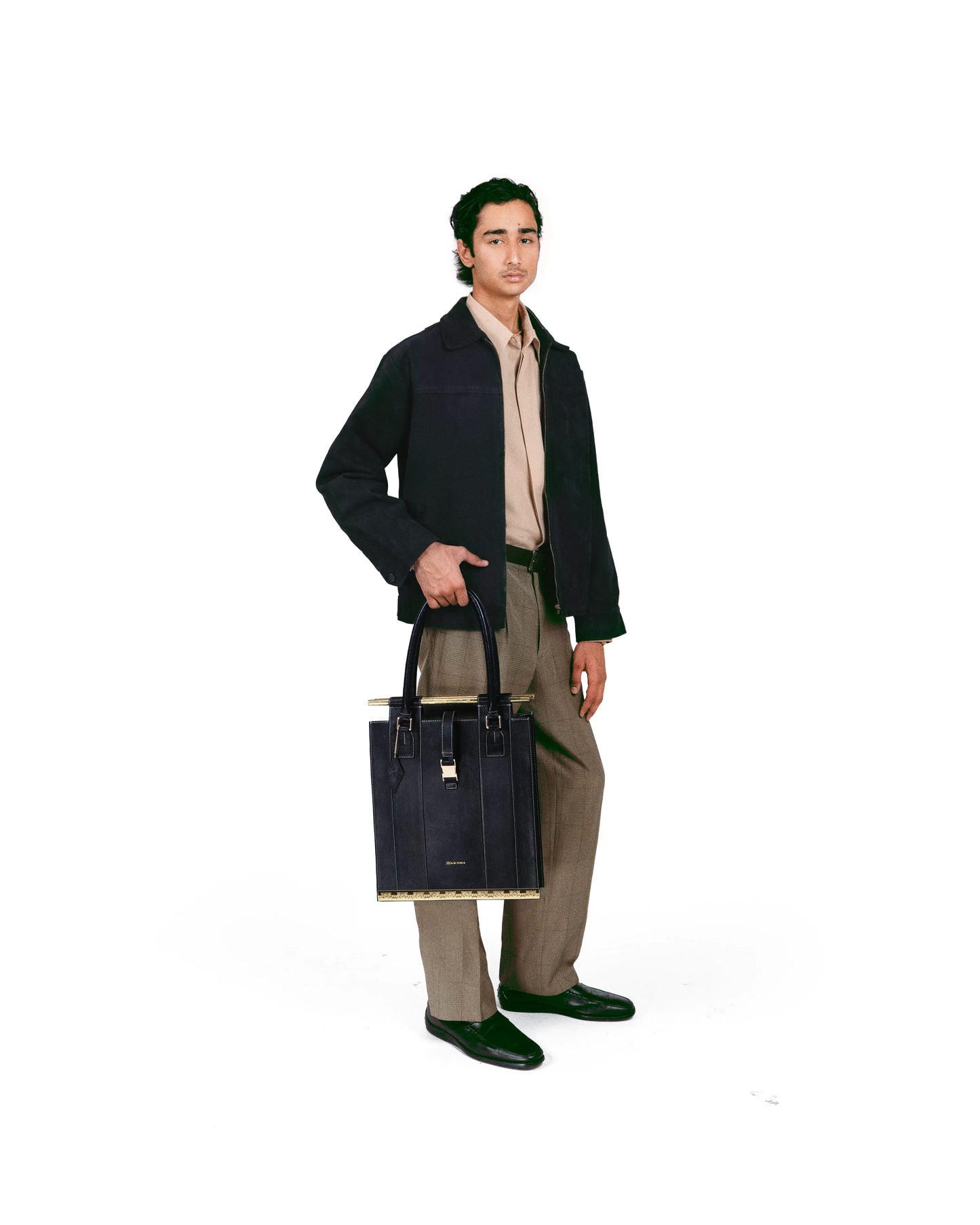 Sculptural tote bag styled with refined contemporary fashion